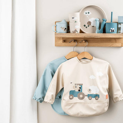 Sleeved pocket bib Tiny farm Sand